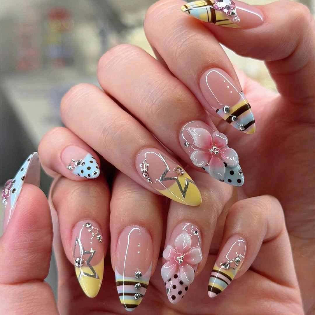 Creative nail designs with floral accents and glitter Bowlift
