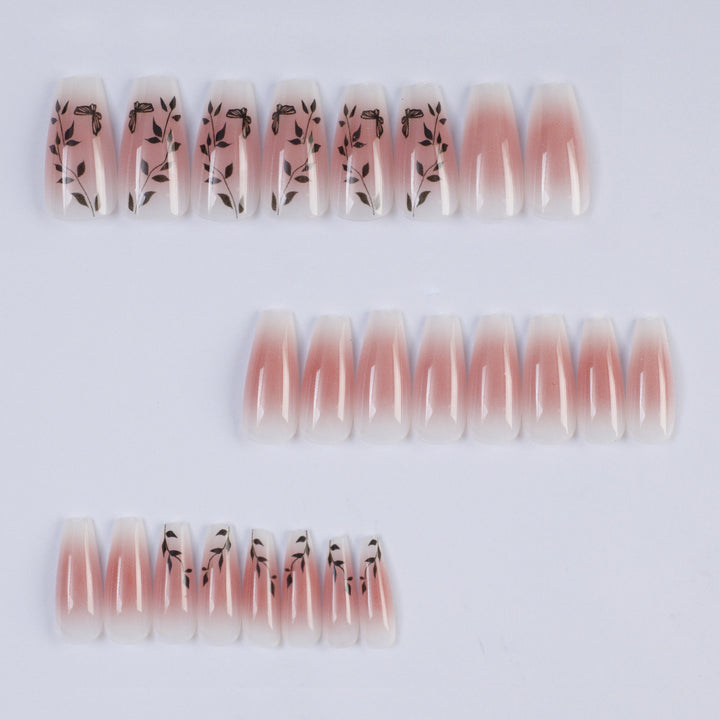 Artificial nails with elegant ombre design and floral accents Bowlift