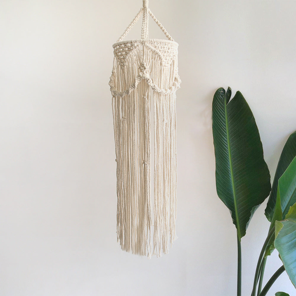 Macrame plant hanger with decorative fringes