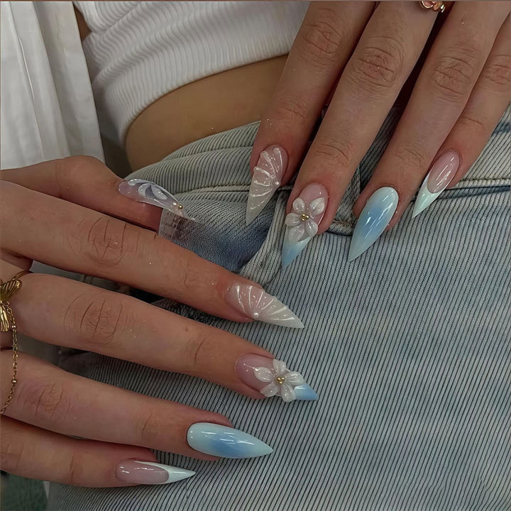 Stiletto nails with floral design and glitter accents Bowlift