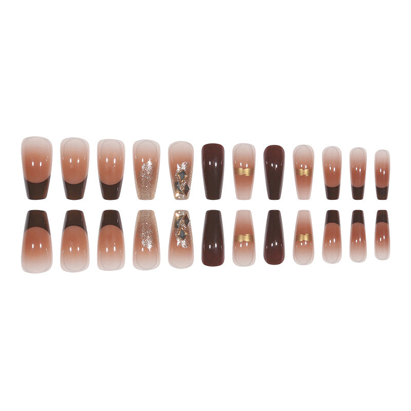 Elegant Long Press-On Nails with Decorative Gold Accents Bowlift