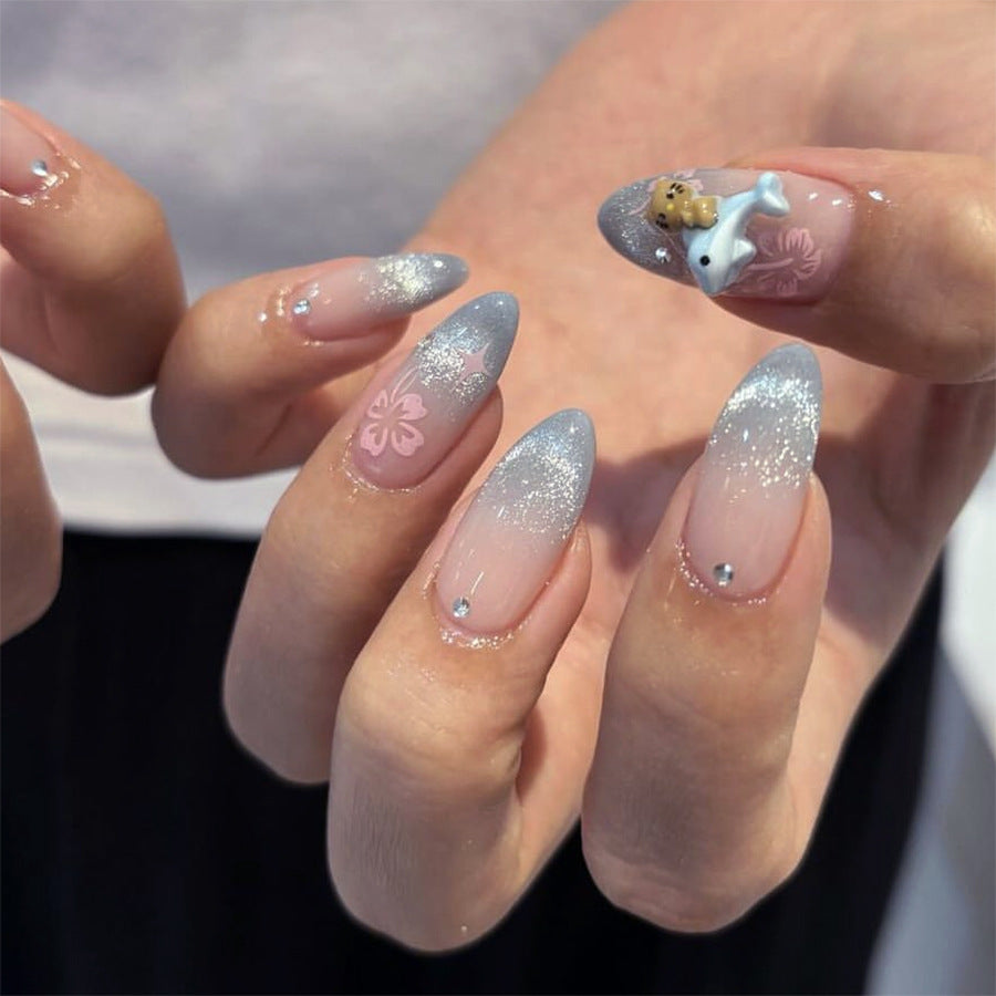 Artful nail extensions with elegant ombré design and floral accents Bowlift