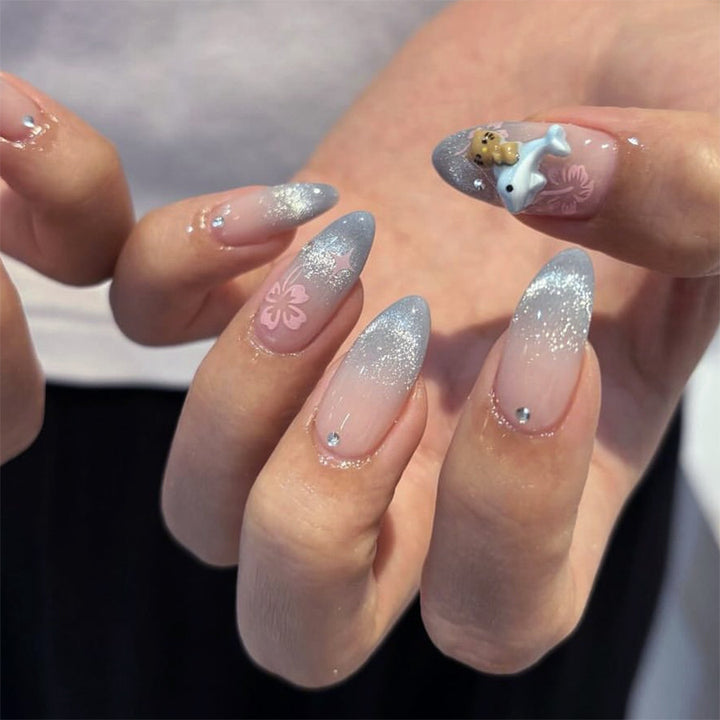 Artful nail extensions with elegant ombré design and floral accents Bowlift