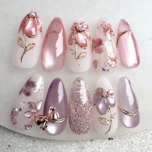 Artificial nail set with decorative flower and glitter embellishments Bowlift