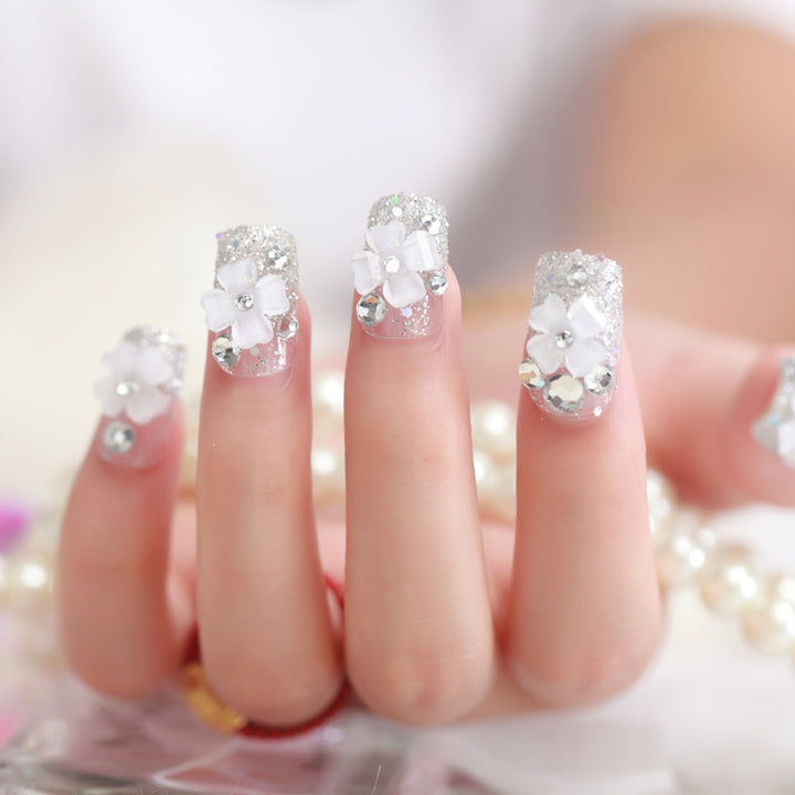Artificial nails with glitter and floral 3D accents Bowlift