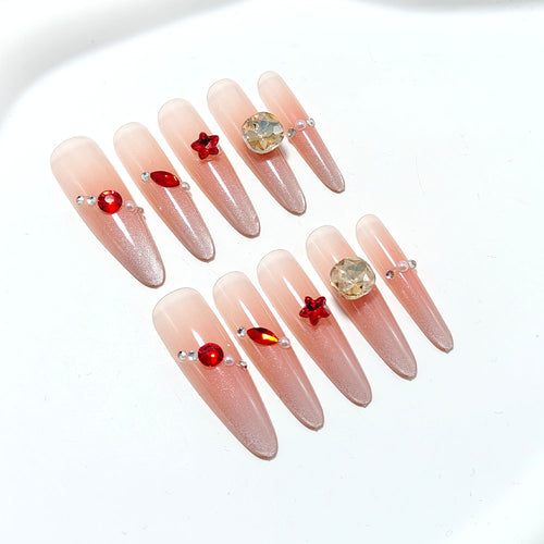 Artificial nails with glamorous decorations Bowlift