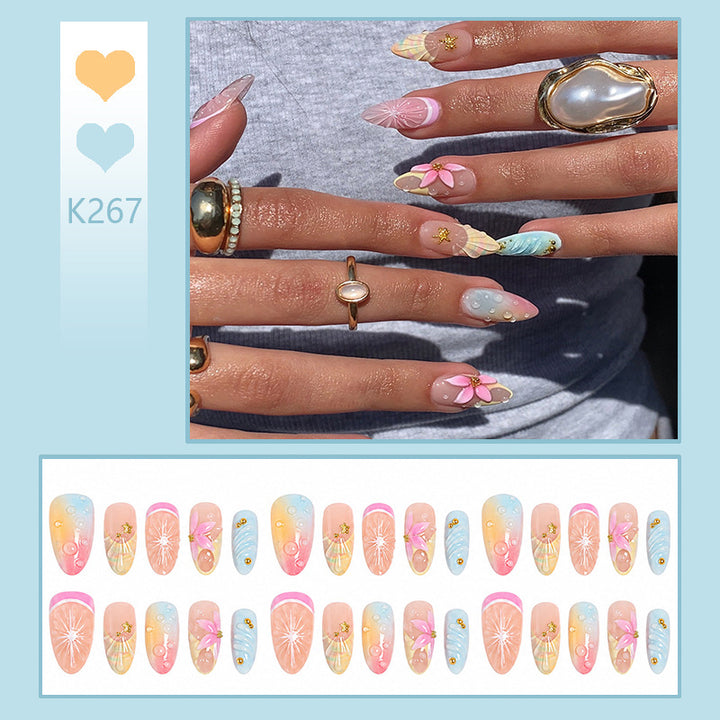 Artificial nail set with elegant floral design and glitter accents Bowlift
