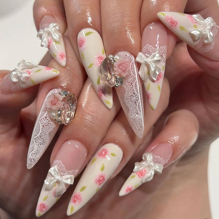 Artful stiletto nails with floral accents and glitter accents Bowlift