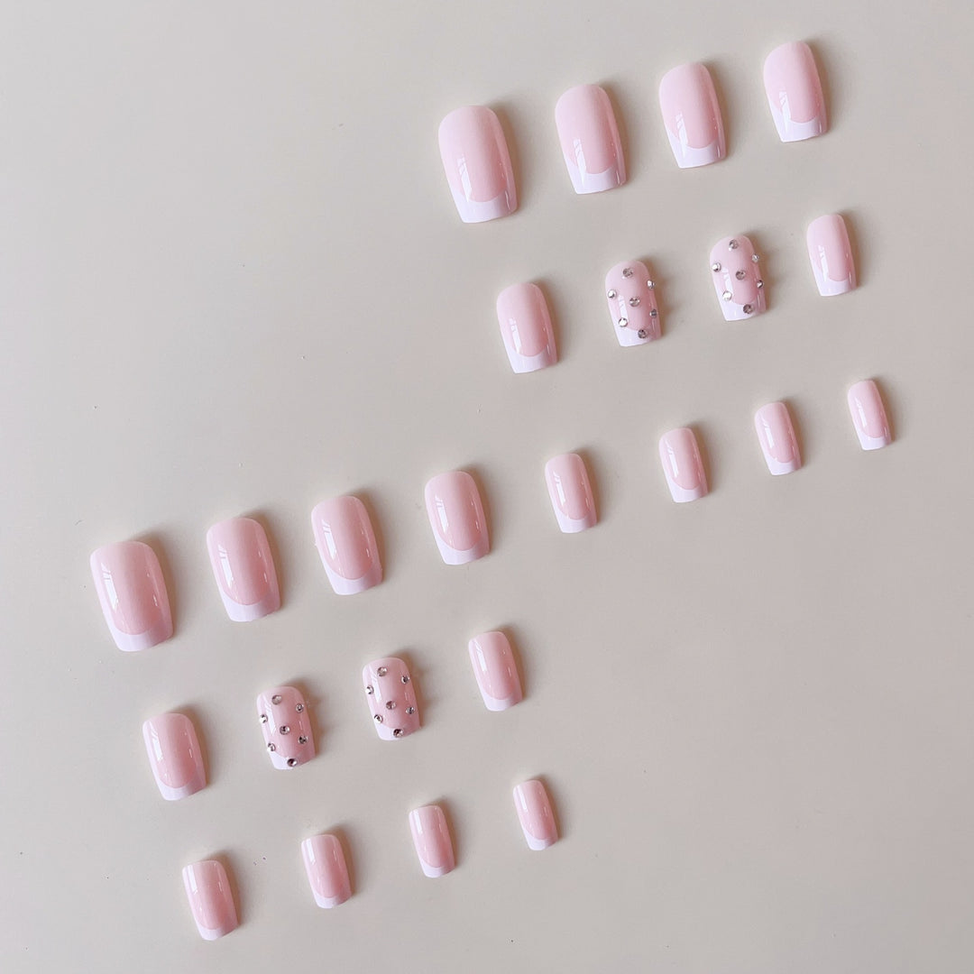 Artificial nail set with elegant rhinestones and French tip decorations Bowlift