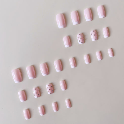 Artificial nail set with elegant rhinestones and French tip decorations Bowlift