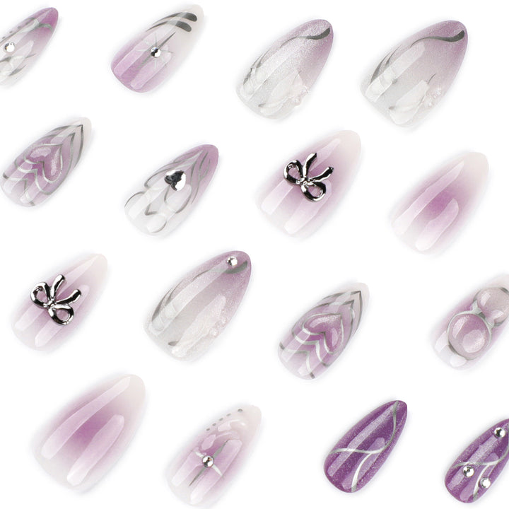 Artful Nail Art with Shiny Accents and Delicate Lilac Bowlift