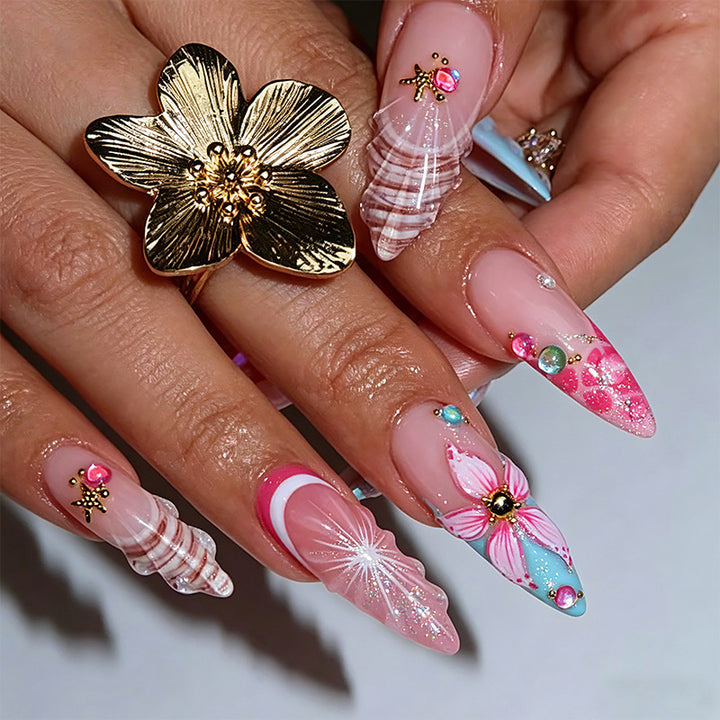 Artificial nail set with glamorous floral designs and creative glitter accents Bowlift