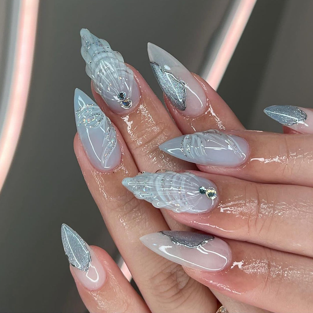 Artful stiletto nails with elegant glitter and floral design Bowlift