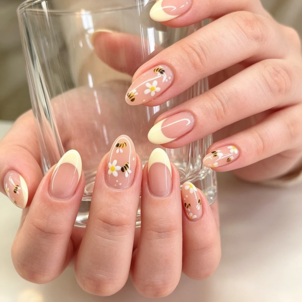 Artistic French Tip Press-On Nail Set with Floral and Bee Designs Bowlift