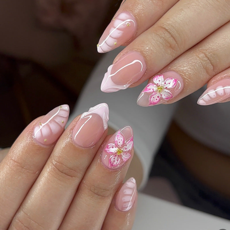 Artful Nail Extensions with Floral Design and Glitter Accents Bowlift
