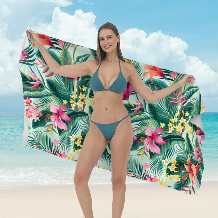 Beach towel with vibrant tropical plant motif Bowlift