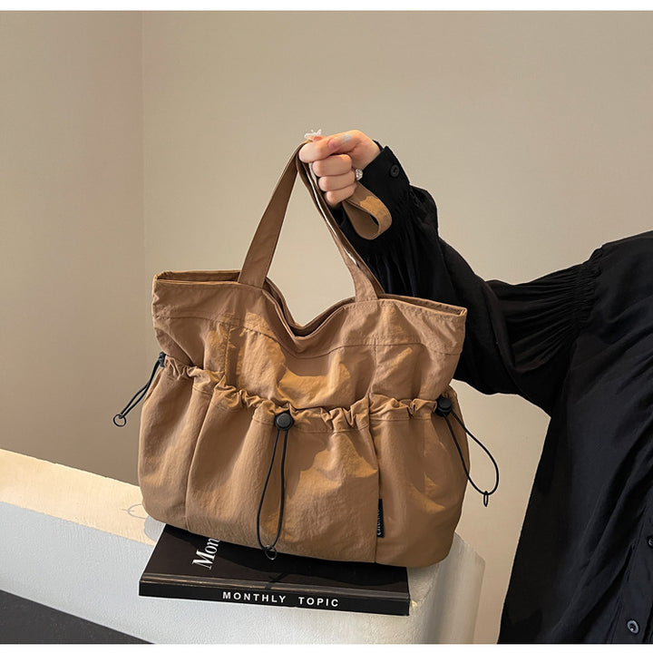Practical everyday handbag with drawstring Bowlift