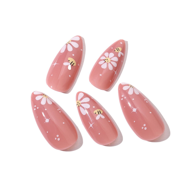 Artificial nails set with elegant flowers and glitter accents Bowlift