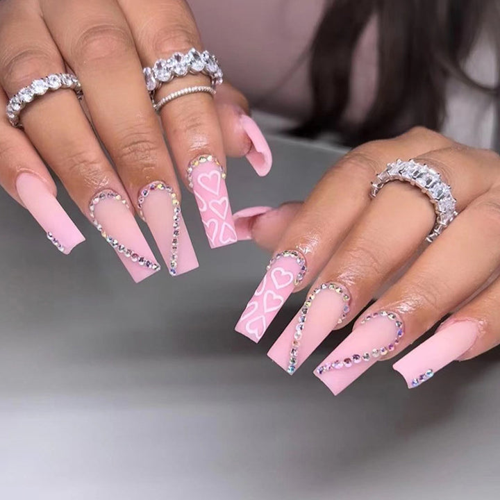 Artful Gel Nails with Elegant Floral Design and Glitter Accents Bowlift