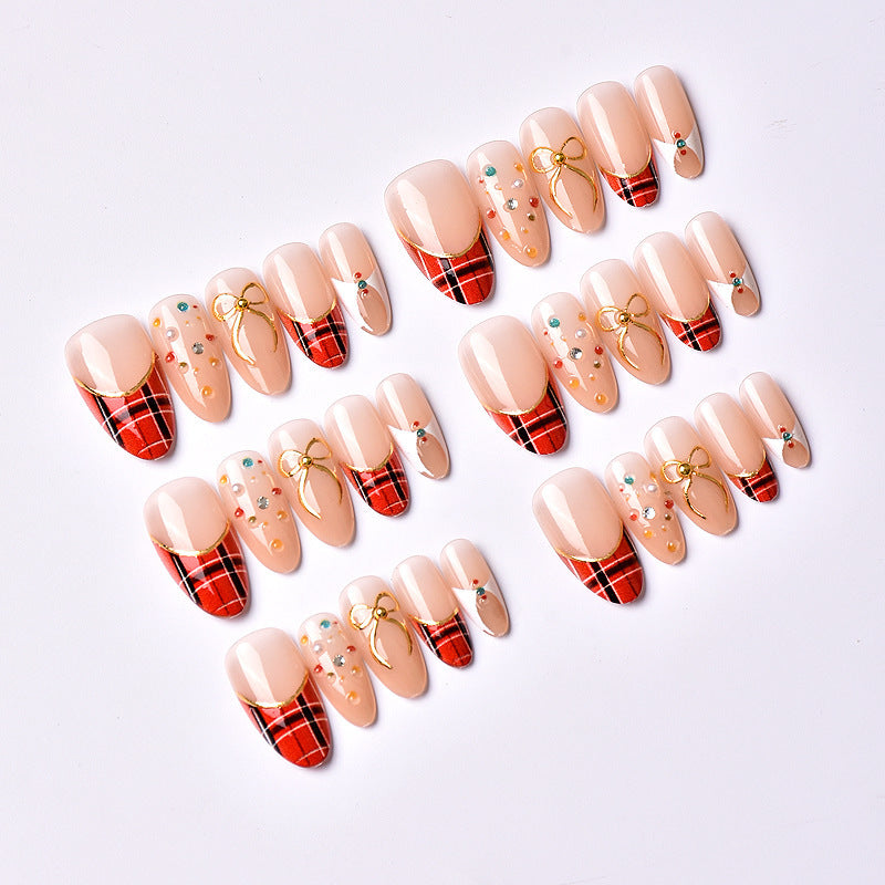 Artificial nail set with festive design and sparkling accents Bowlift