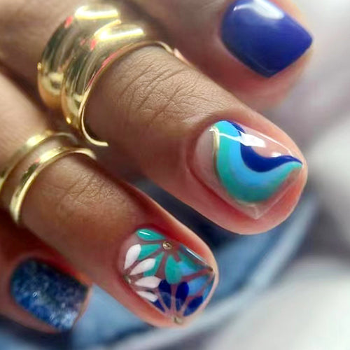 Artful nail design with floral and geometric patterns Bowlift