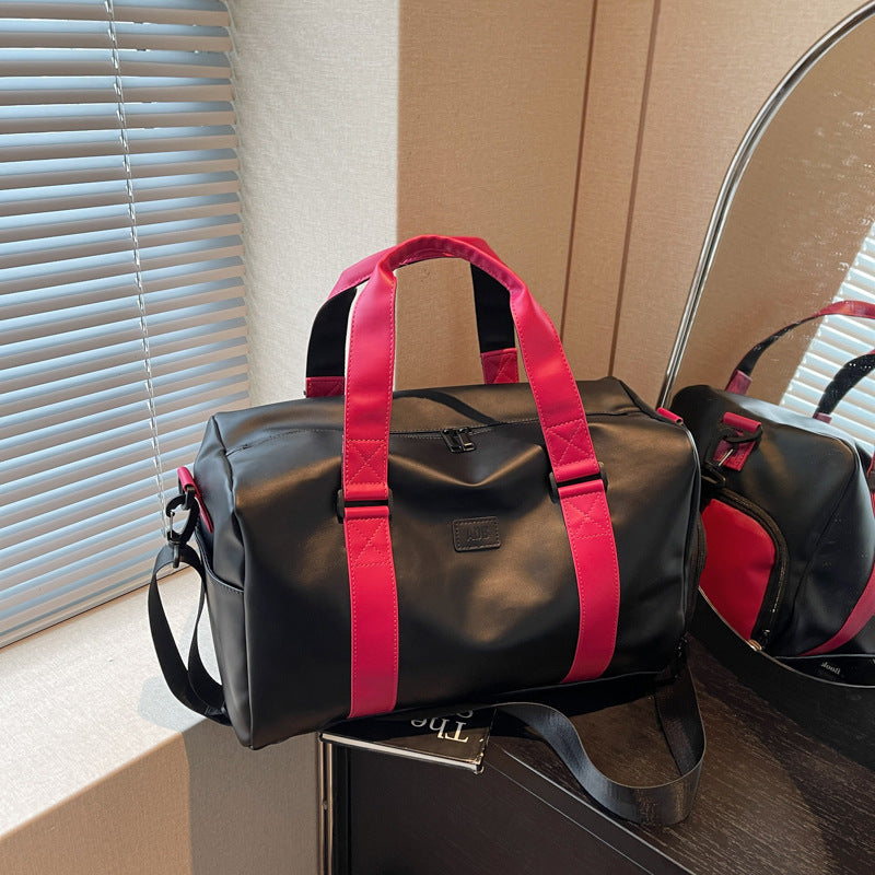 Sporty duffel bag with durable water-repellent material and versatile carrying options Bowlift