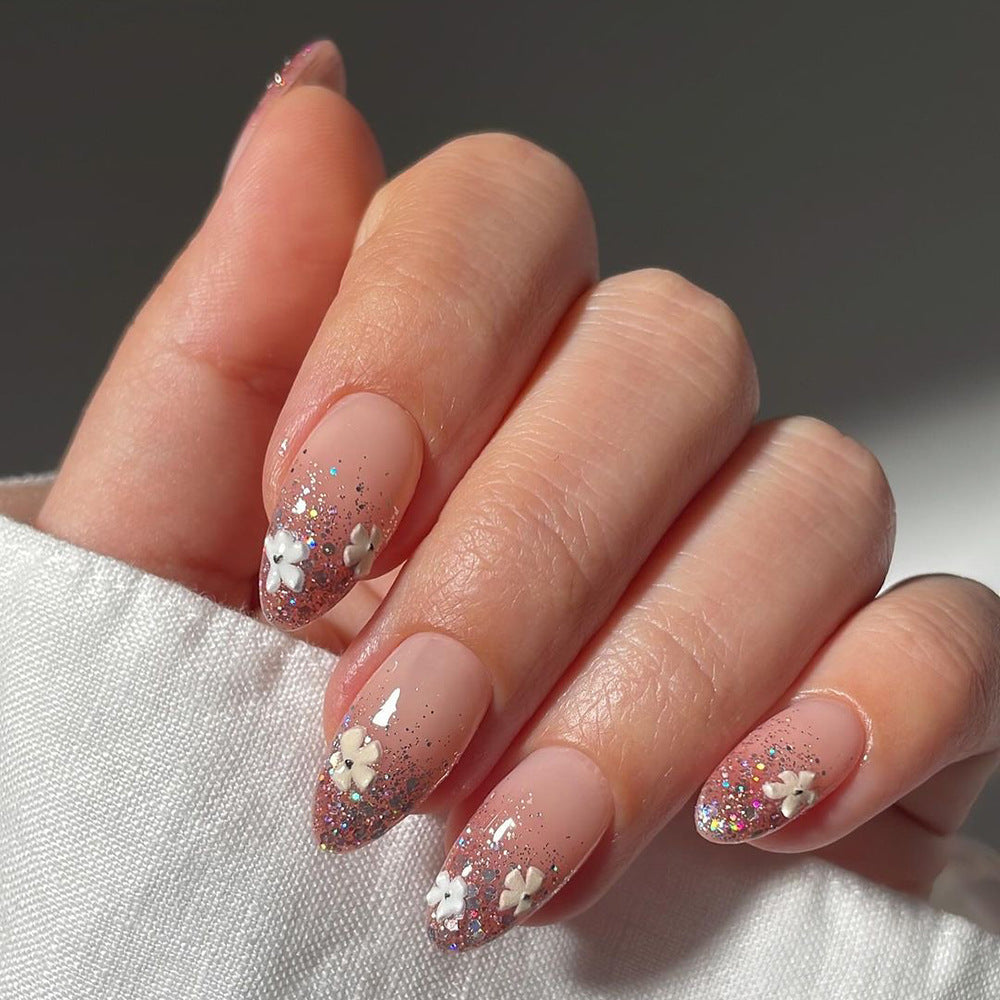 Glamorous nail extensions with glittering and floral design Bowlift