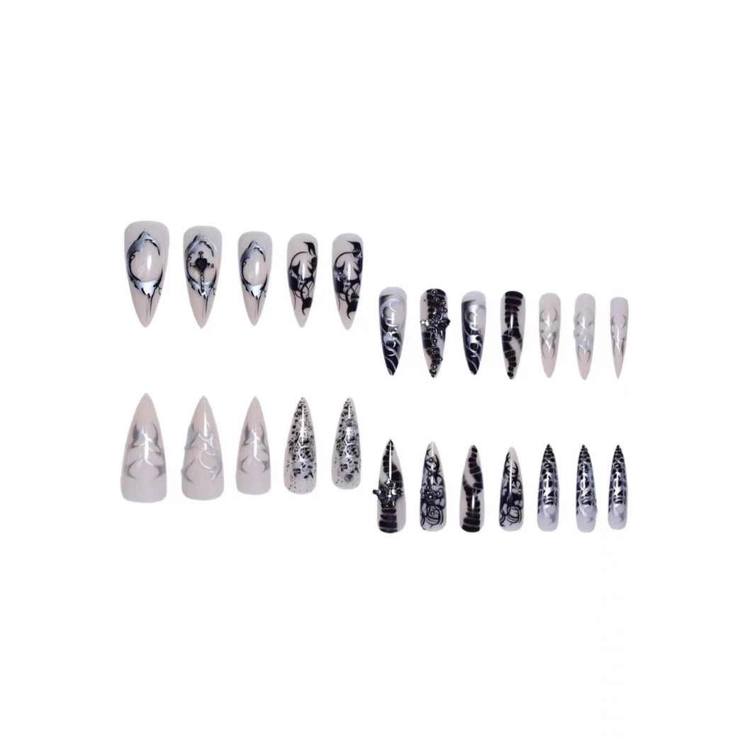 Artistic Stiletto Nail Enhancements with Intricate Patterns Bowlift