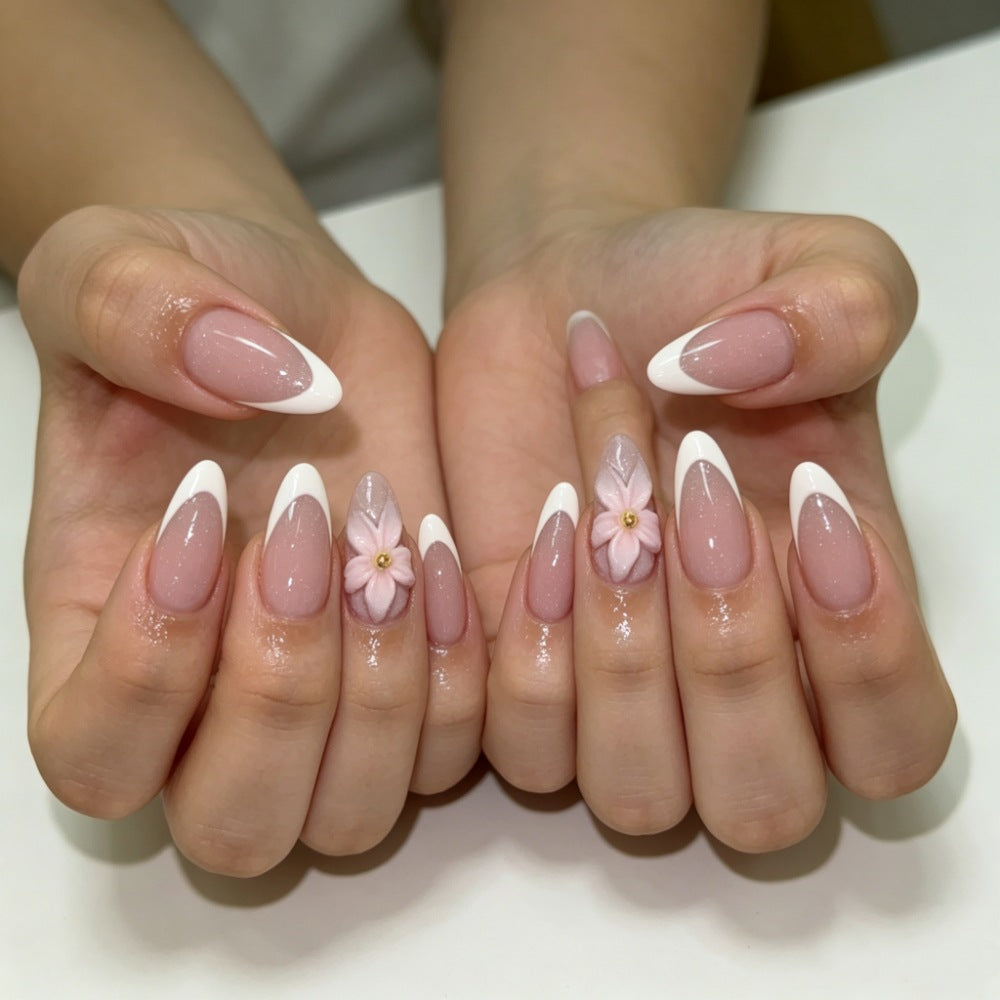Artificial nails with floral decoration and elegant French tip design Bowlift