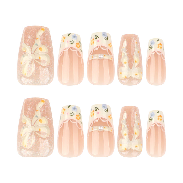 Artful Nail Extensions with Floral Design and Bow Accents Bowlift