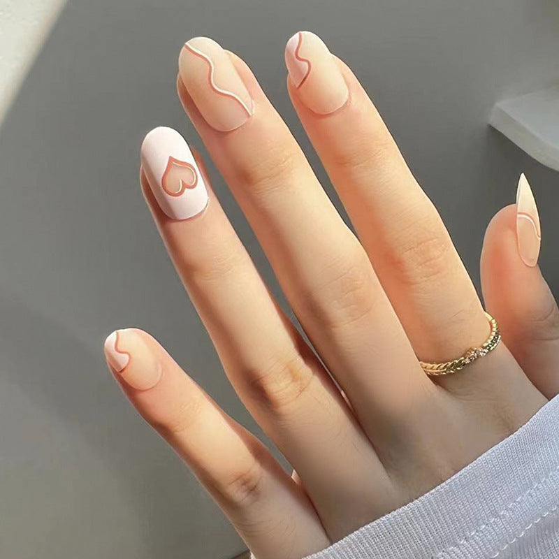 Artful Nail Extensions with Elegant Heart Design Bowlift