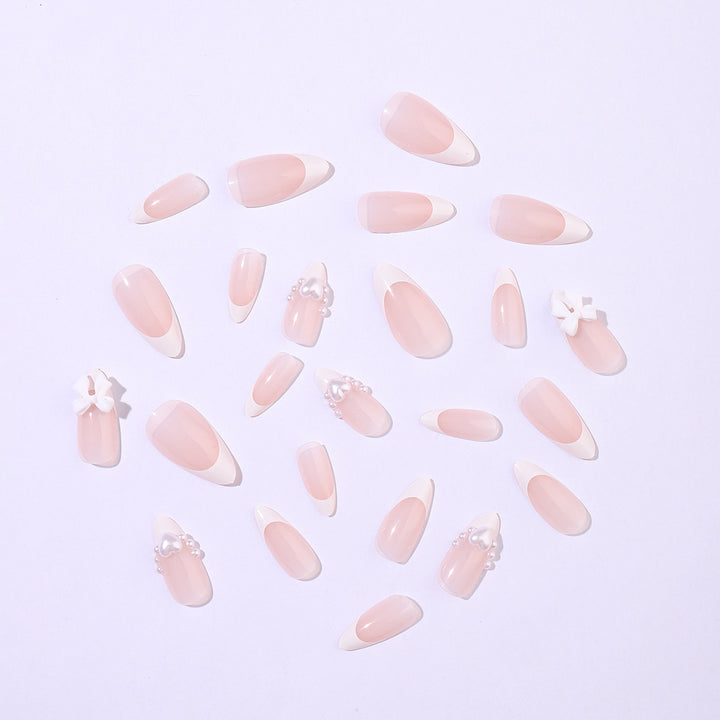 Artificial nail set with elegant pearl and bow decorations Bowlift
