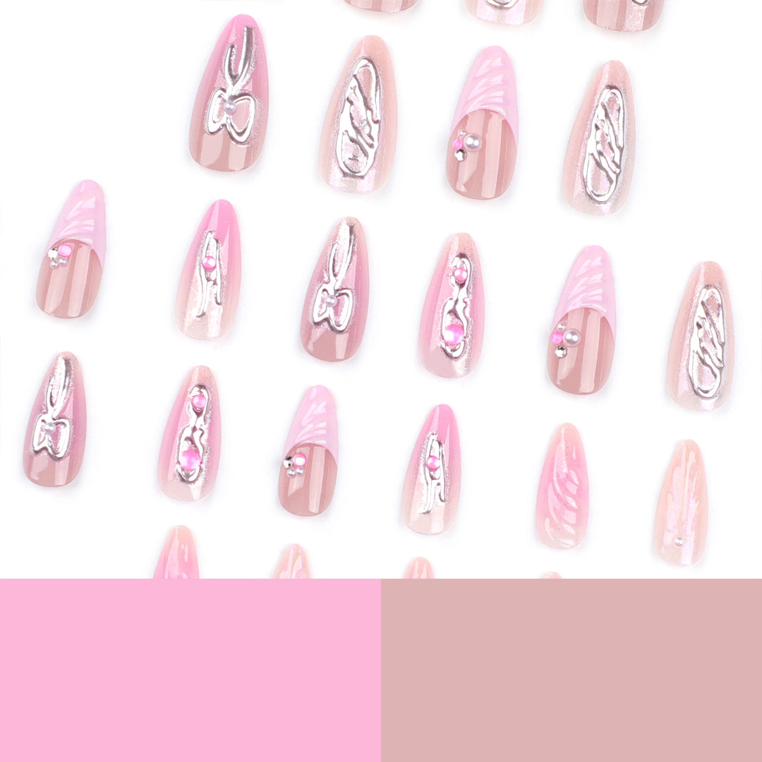 Artful stiletto nails with glitter and pearl decorations Bowlift