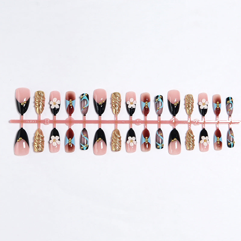 Artificial nail set with filigree floral decorations and glamorous accents Bowlift