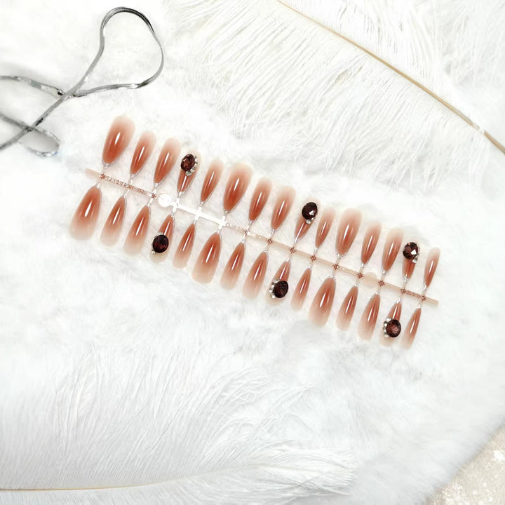 Glamorous artificial nails in elegant ombre style with rhinestone embellishments Bowlift