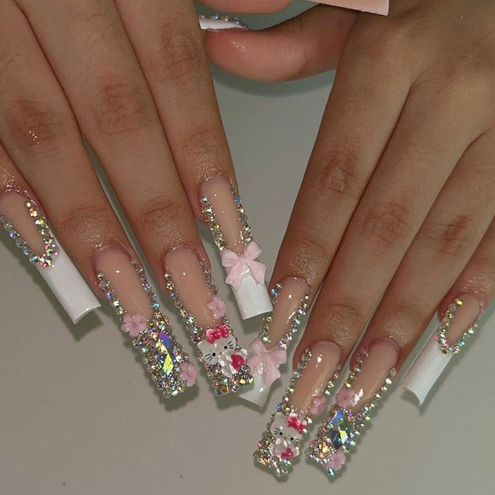 Glamorous artificial nail set with sparkling rhinestone embellishments and creative animal designs Bowlift
