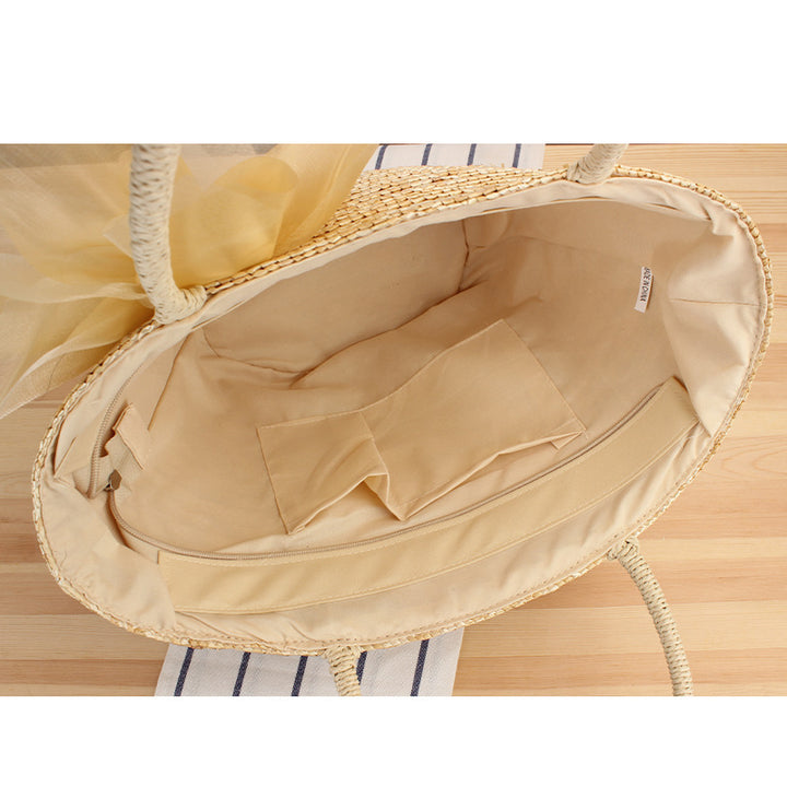 Elegant straw bag with floral accents Bowlift