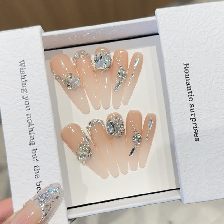 Artificial nails with exclusive rhinestone embellishments Bowlift