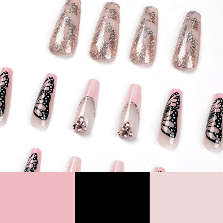 Glamorous nail extensions with beautiful butterfly motifs and glitter accents Bowlift