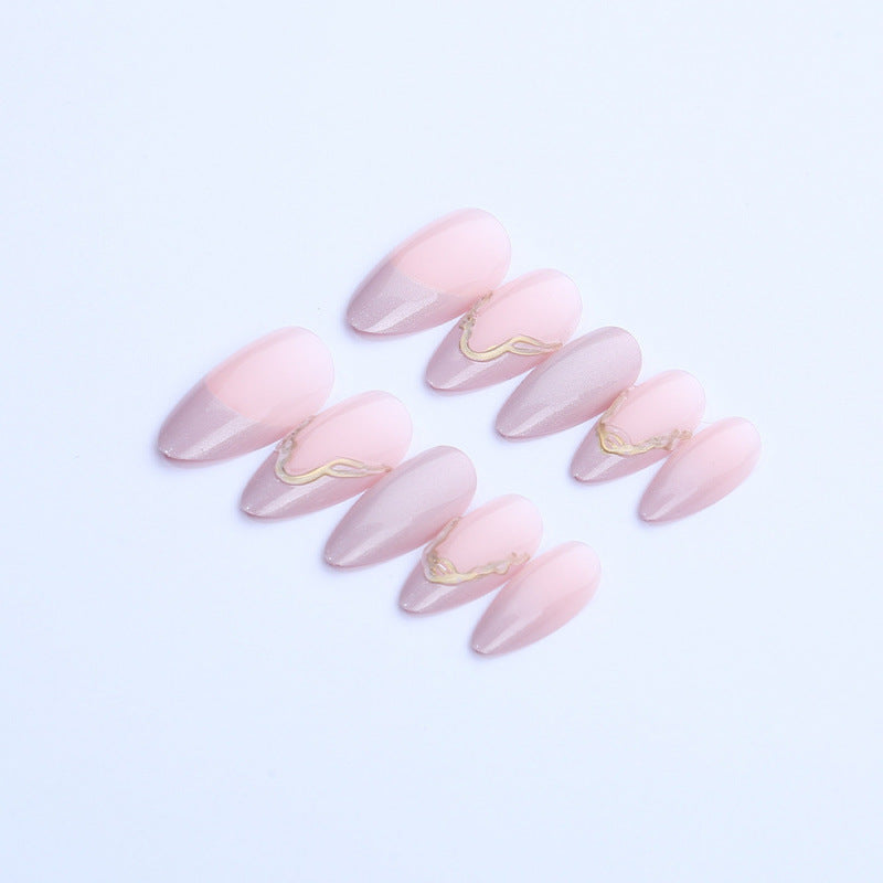 Acrylic nail set with glamorous tips and golden accents Bowlift