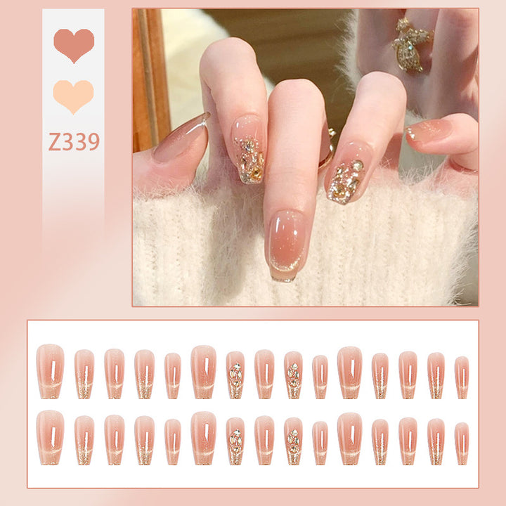 Artificial nail set with sparkling glitter and 3D applications Bowlift