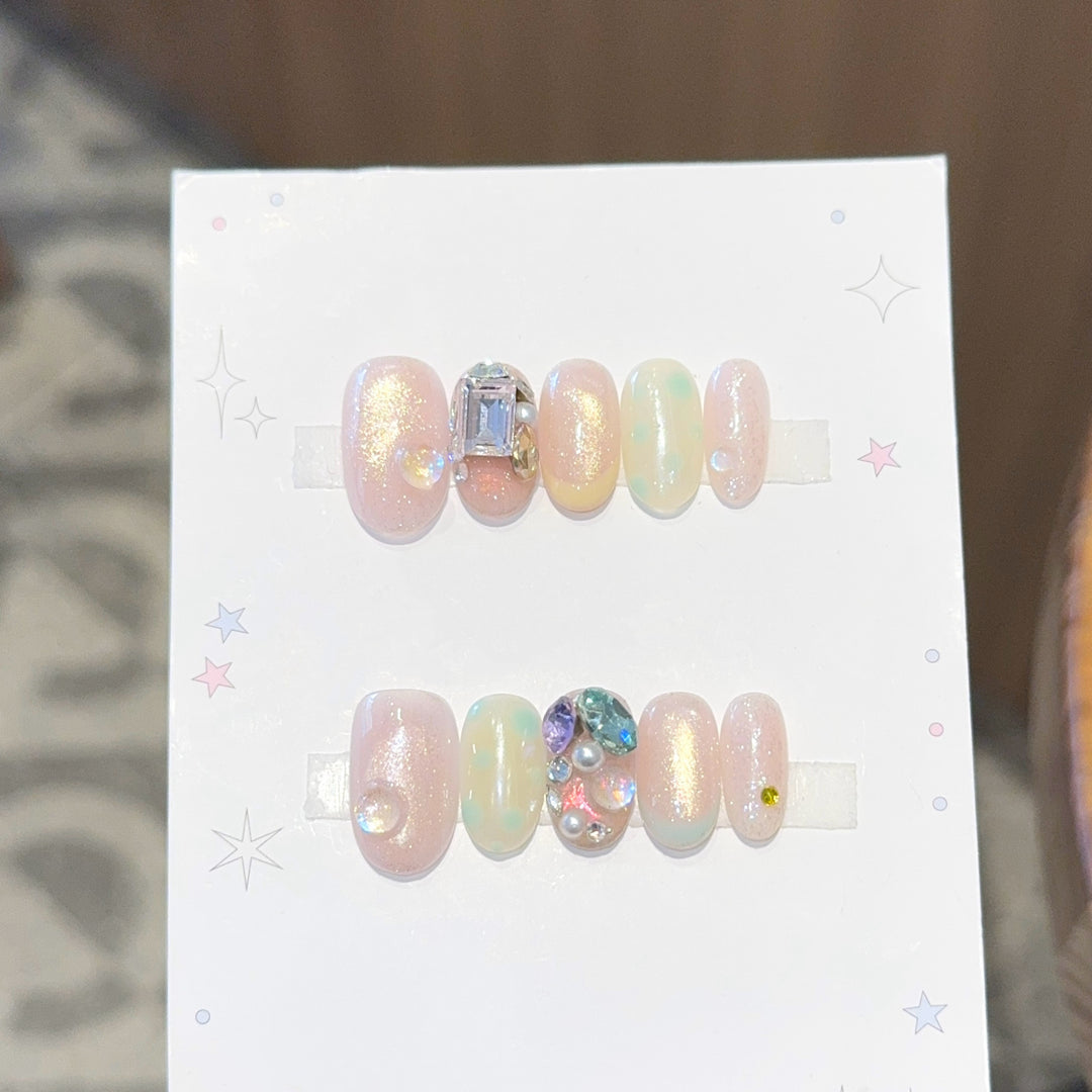 Artificial nails with shimmering effects and crystal accents Bowlift