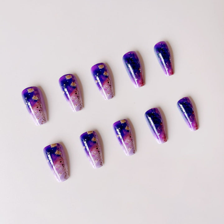 Glittering artificial nail tips in galaxy design Bowlift