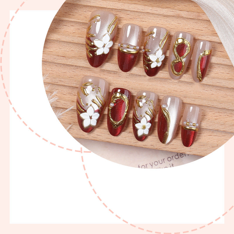 Artistic Press-On Nail Set with Floral and Metallic Accents Bowlift