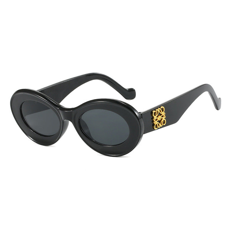 Women's fashionable sunglasses with oval frame and golden accents Bowlift