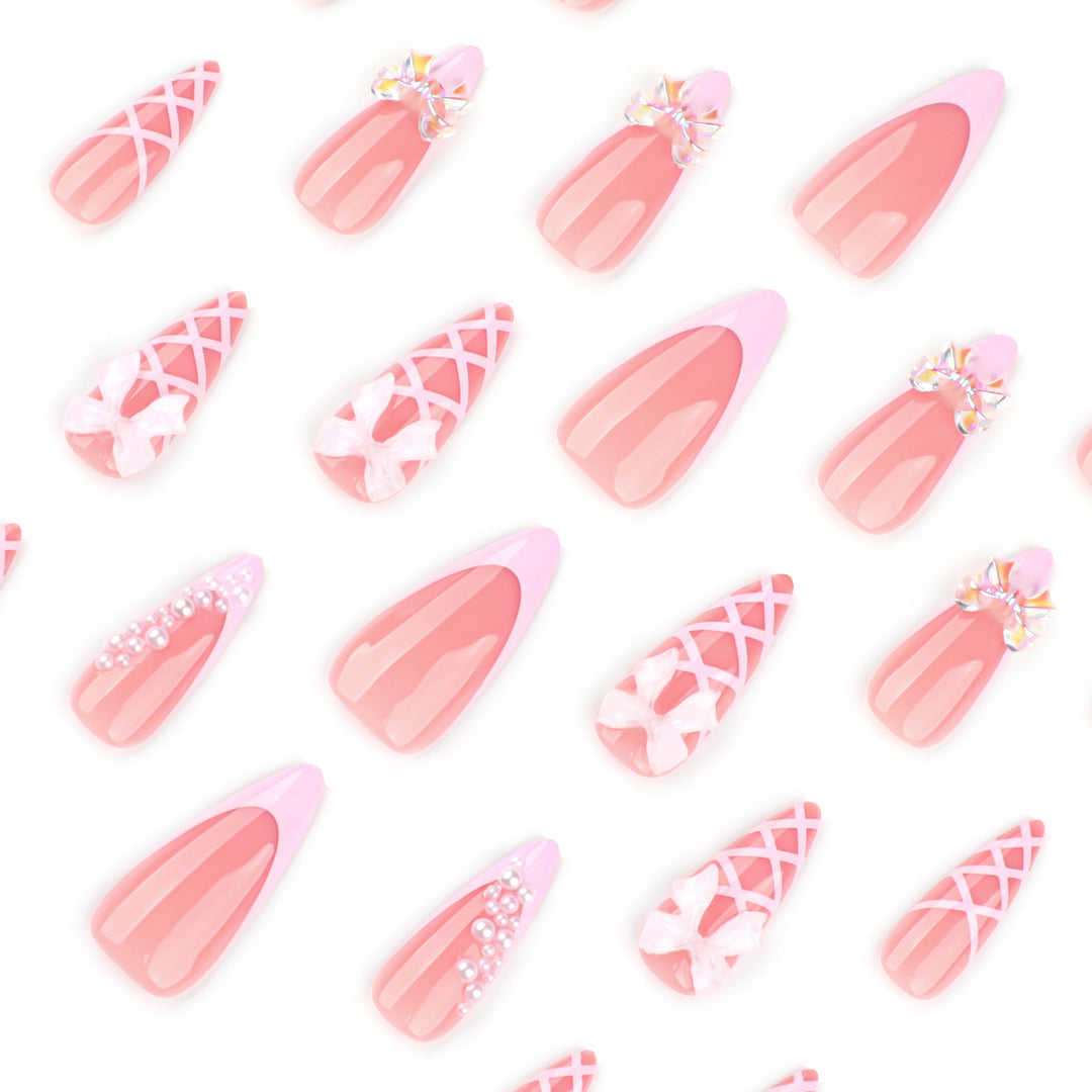 Artful stiletto nails with glitter and bow decoration Bowlift