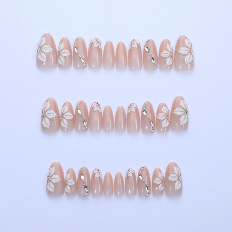 Artificial nail set with elegant flower designs and shimmering accents Bowlift
