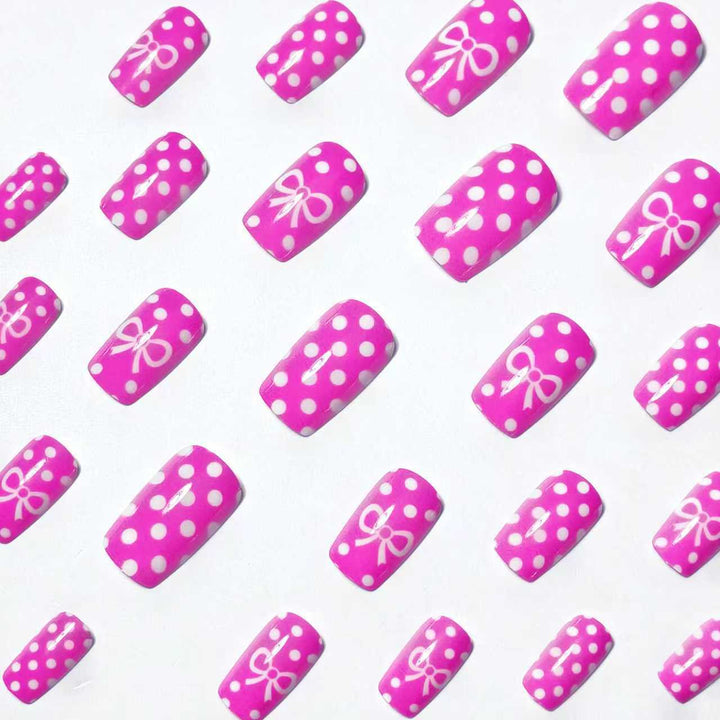 Artificial nails with romantic polka dot pattern and bow Bowlift