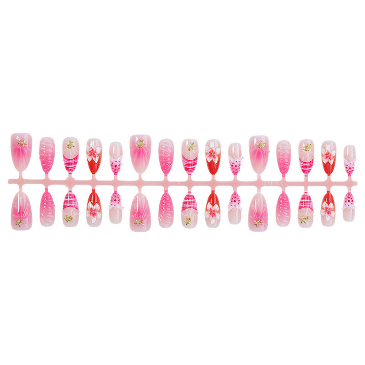 Acrylic nail set with luxurious glitter and flower accents Bowlift