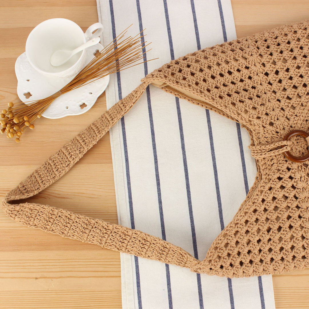 Handbag made of hand-knotted natural material with chic tassel decoration Bowlift